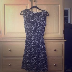A black dress with white polka dots
